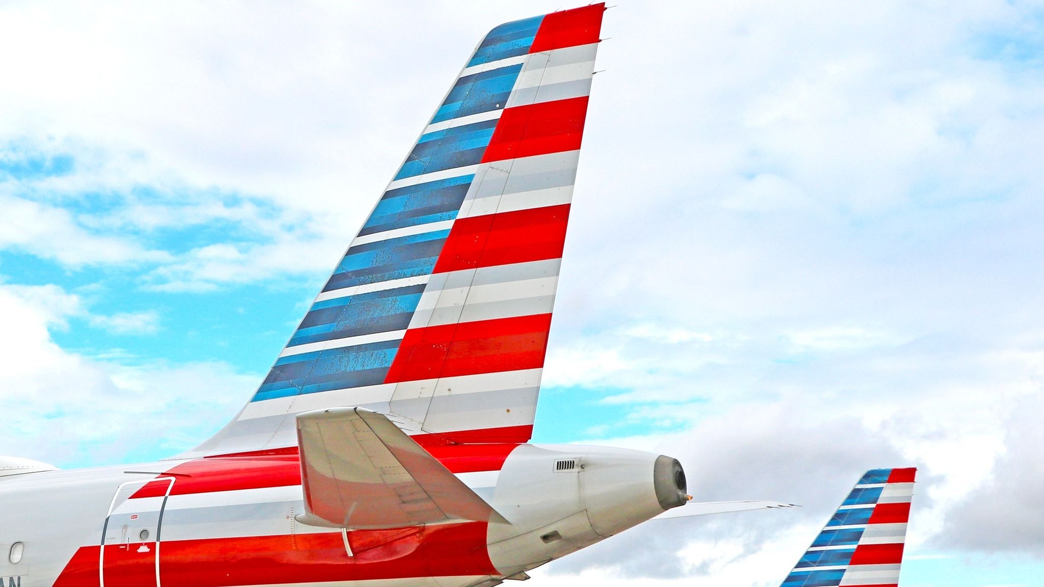 マイレージ収益の増加で乗客に報いるためのアメリカン航空